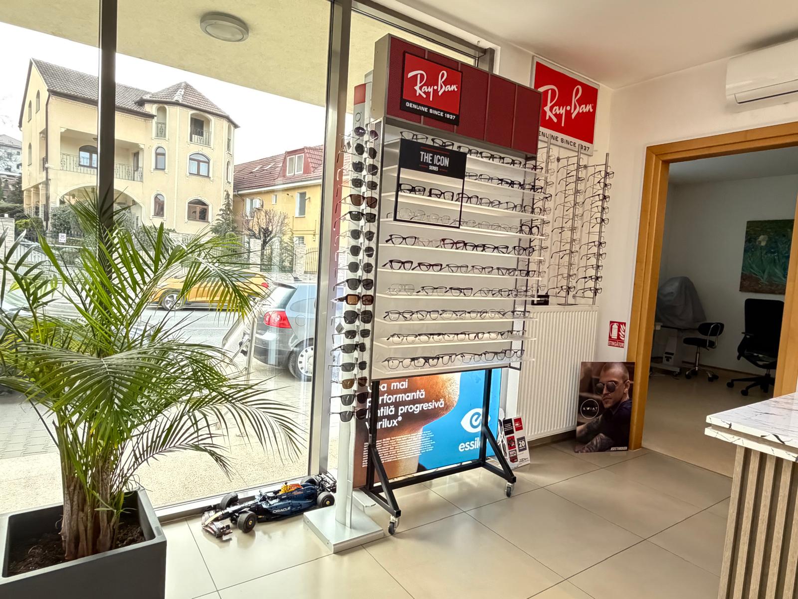 Selection of premium designer eyeglass frames displayed in a modern optical shop